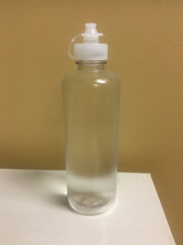 8 oz bottle on a yellow background. Cylindrical shape with a nozzle based flip cap. 