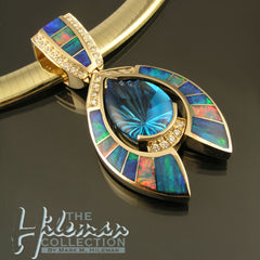 Australian Opal pendant with blue topaz and diamond accents set in yellow gold