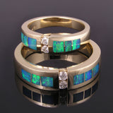 Opal wedding ring set with diamonds set in 14k gold.