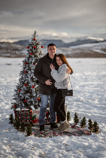 Couple getting engaged in the snow