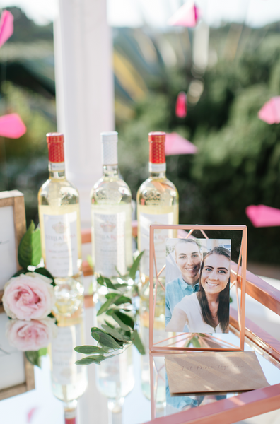 rose gold picture frame on bar cart