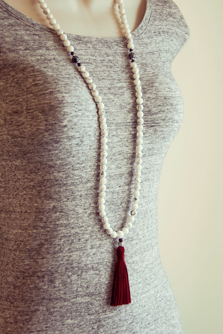 A mala can be worn as a necklace.