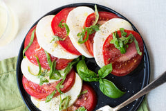 easy caprese salad with tomatoes and fresh mozzarella slices
