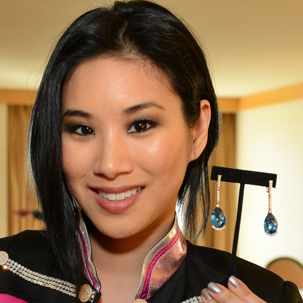  A member of Blush Girl Group posing with Alex Soldier's Stunning White Gold Swan Earrings