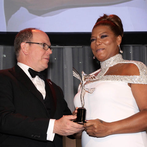 HSH Prince Albert II of Monaco presenting Queen Latifah with Princess Grace Award, designed and created by Alex Soldier.