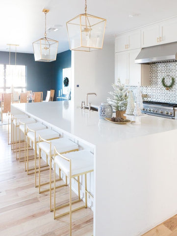 White kitchen with brass hardware and fixtures designed by CC and Mike