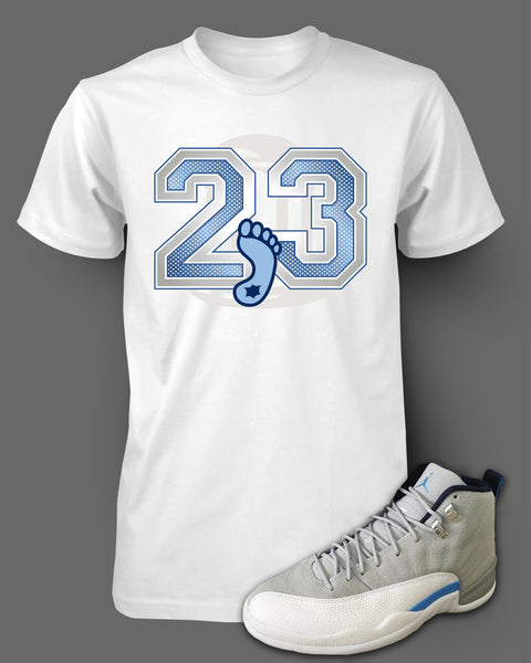 grey and blue jordan shirt