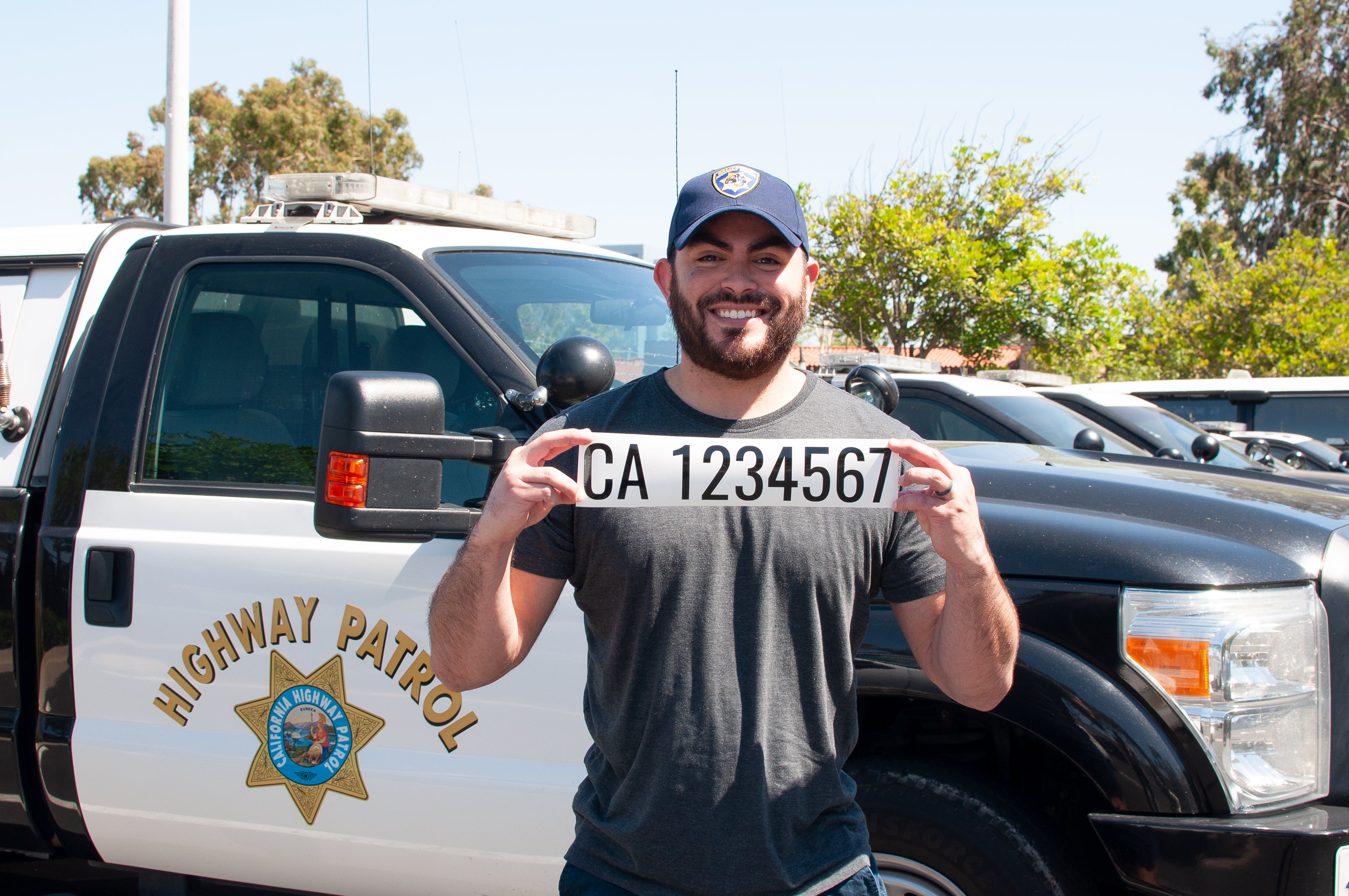 highway patrol officer holding ca usdot number decal