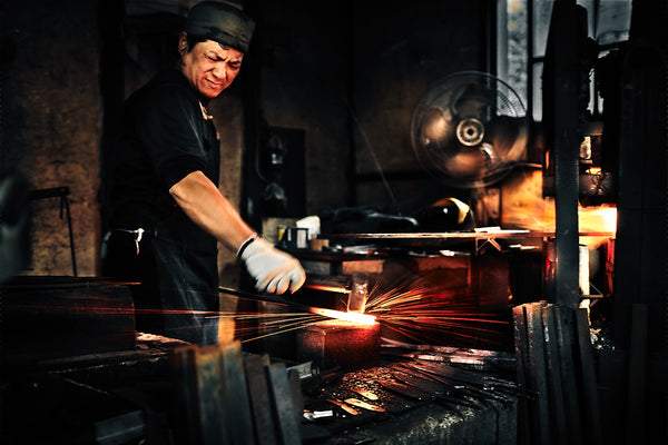 Forging the steel to make Japanese knife