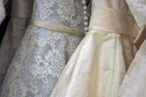 Wedding Dresses Hanging Up In Bridal Shop