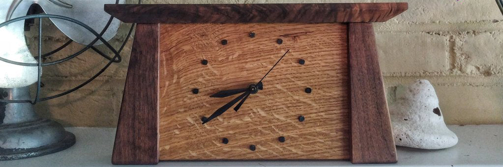 Walnut and oak clock on a mantel