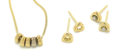 Idun 18 carat gold diamond necklace and earrings by Annika Rutlin