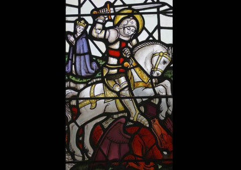 st george slaying the dragon depicted in stained glass. Who was St George?