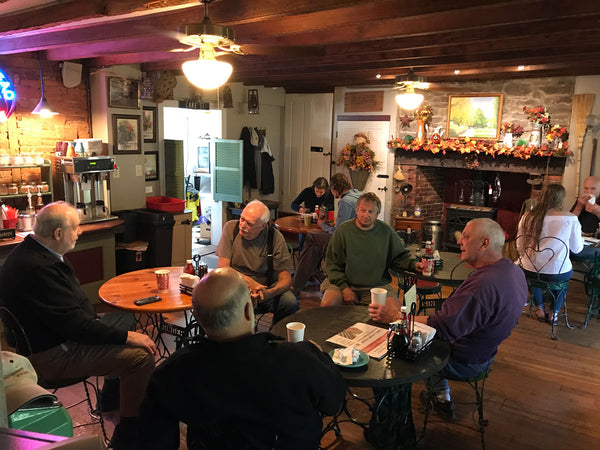 Customers chatting and eating breakfast at Homestead General Store