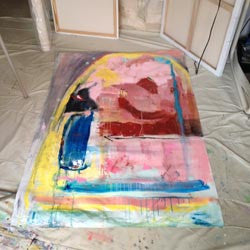 large abstract painting with pink, yellow, green, rusty red and charcoal on unstretched canvas