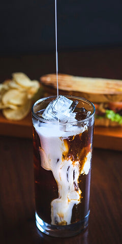 cold coffee brew poured with milk