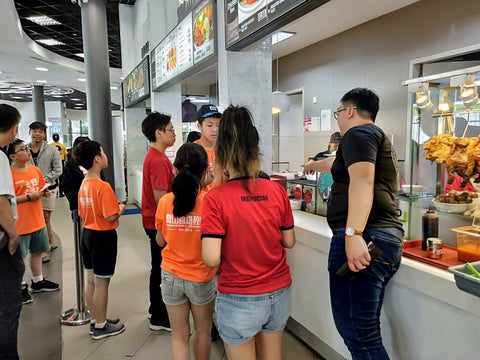 Tertiary Immersion Program facilitator guiding food ordering food choices