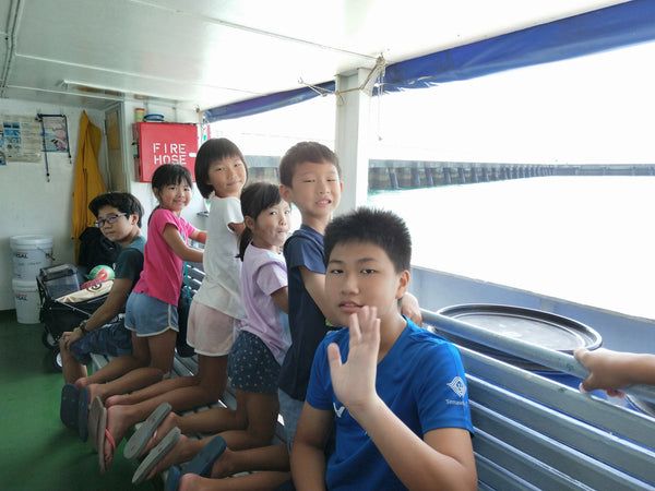 Children on a ferry to St John's island
