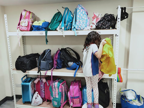 A participant independently packing her bag