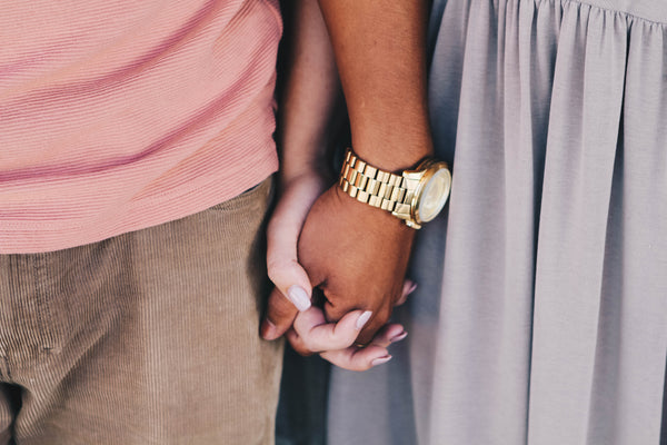 Couple holding hands