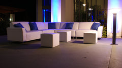 Picture of white lounge sofas with blue accent pillows