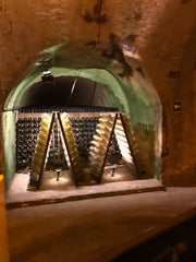 Tradtional champagne bottle ageing in the Epernay cellars