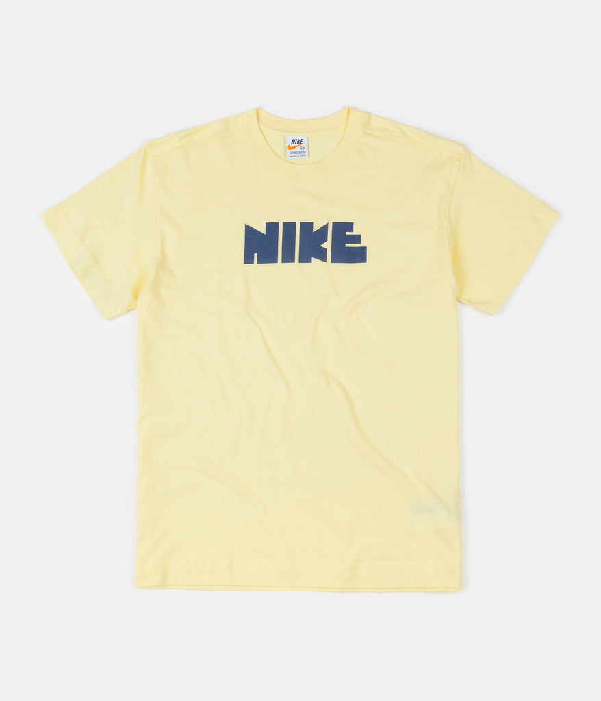 grey and yellow nike shirt