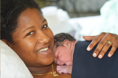 Mother holds infant during Golden Hour in the O.R.