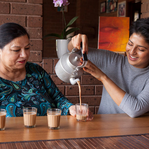 Uppma Virdi and her mother making chai together at a table
