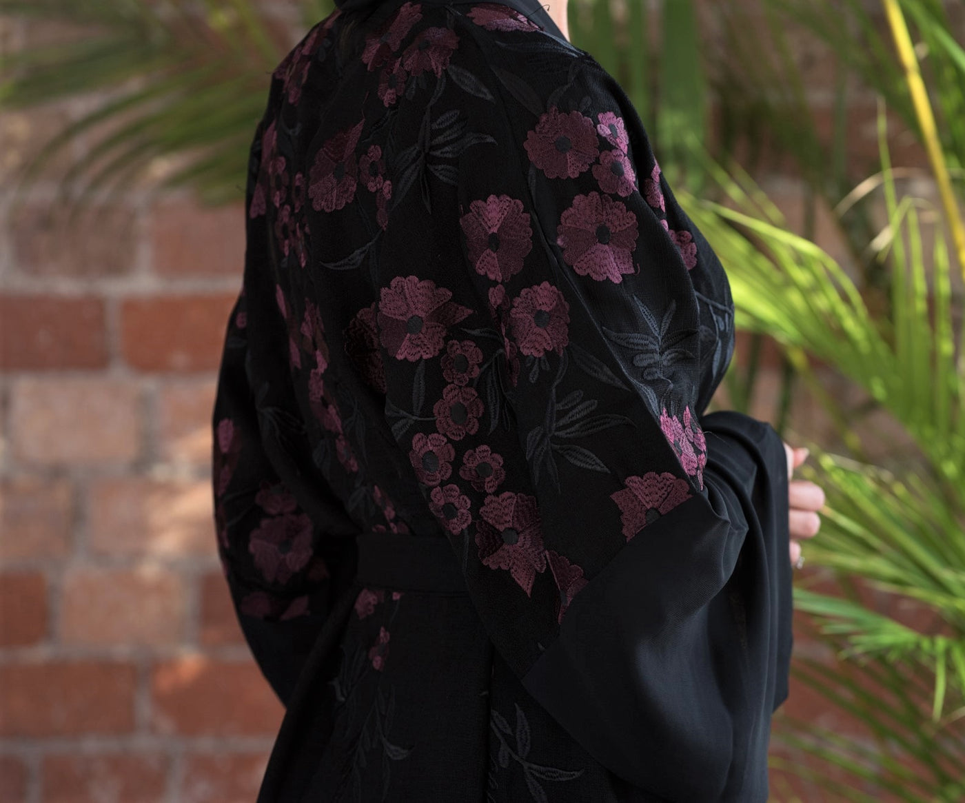 Aaliya Collections A classic black abaya with contrasting burgundy floral embroidery