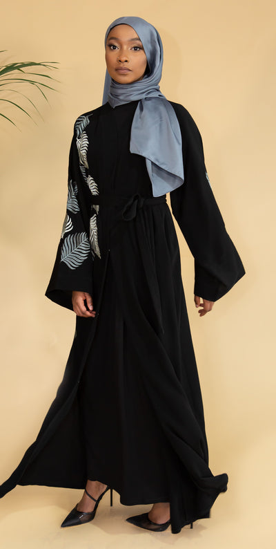 Aaliya Collections Grey Leaf Abaya Created with contrast in mind, a stunning black abaya with gorgeous grey shades in leaf embroidery