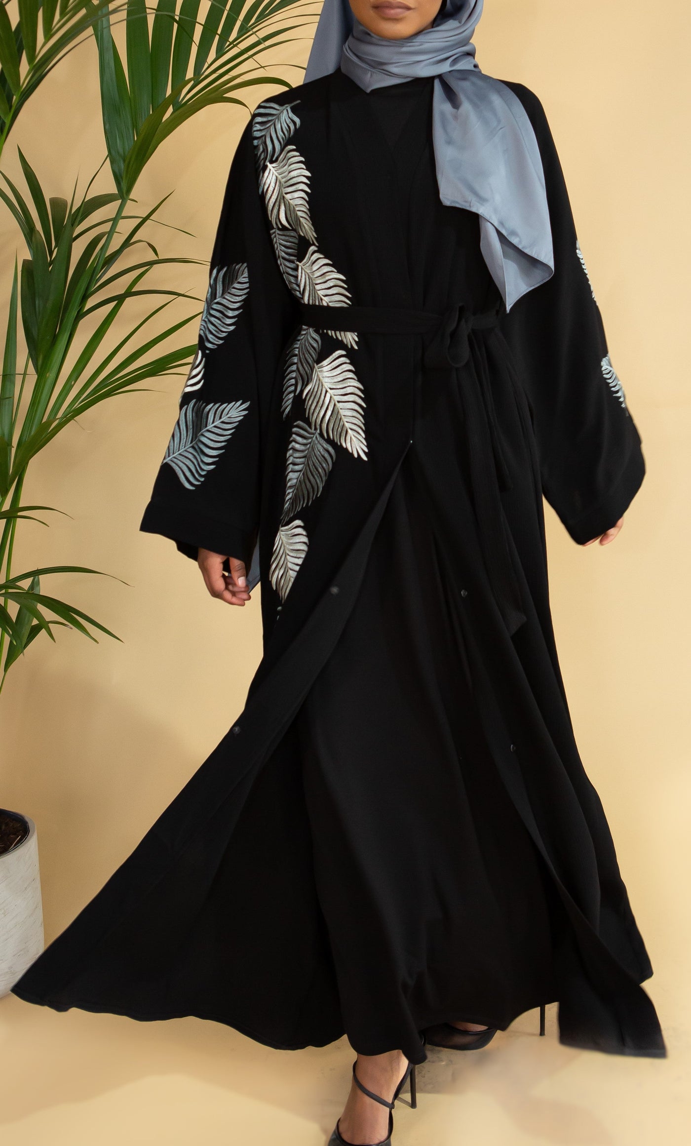 Aaliya Collections Grey Leaf Abaya Created with contrast in mind, a stunning black abaya with gorgeous grey shades in leaf embroidery