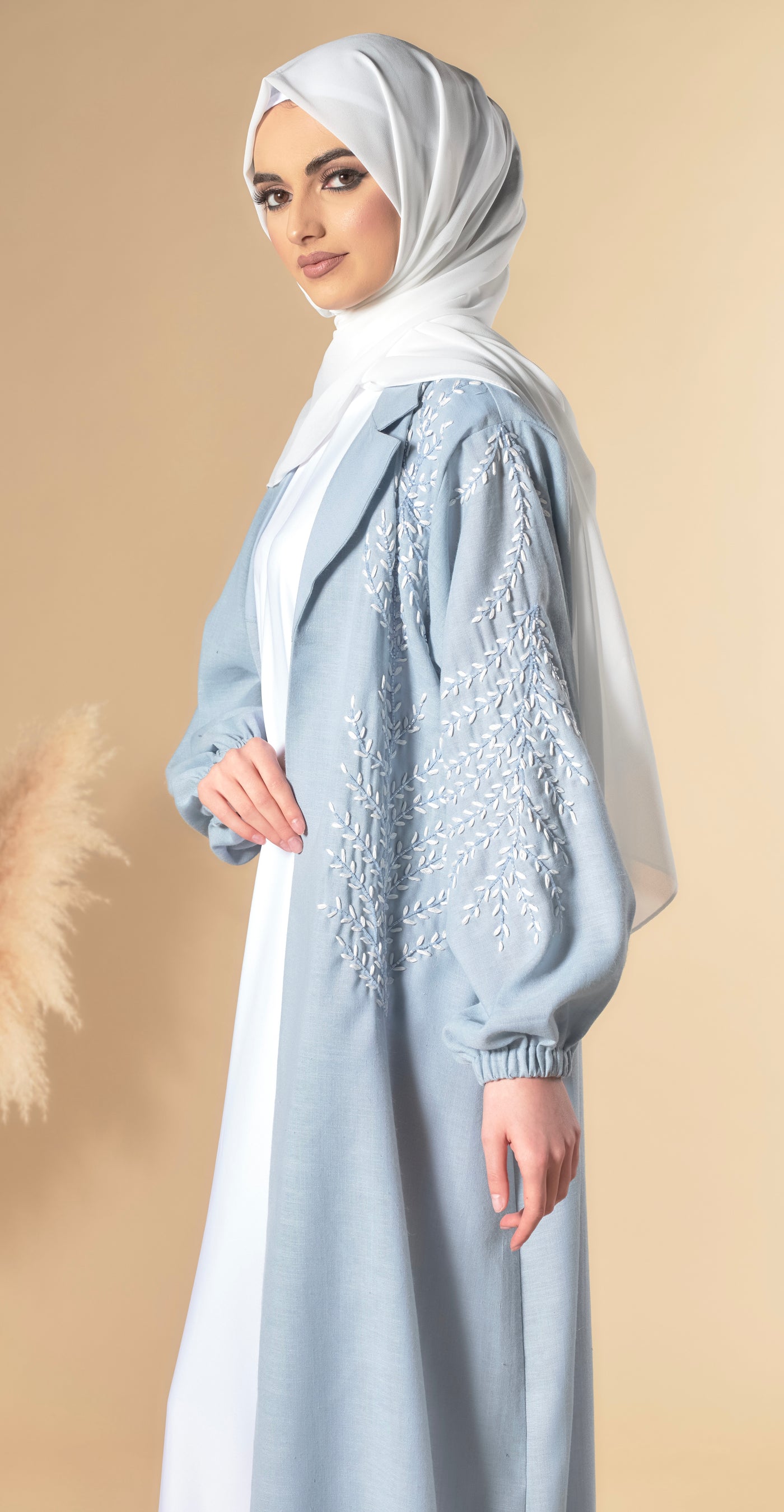 blue abaya with leaf embellishments