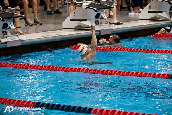 A3 Performance swimmer fist pumping after a swim race in the pool
