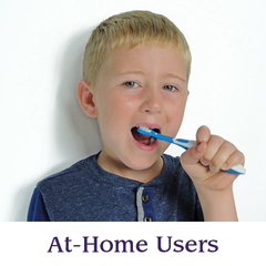 A boy brushes his teeth with a Surround Toothbrush | Specialized Care Co