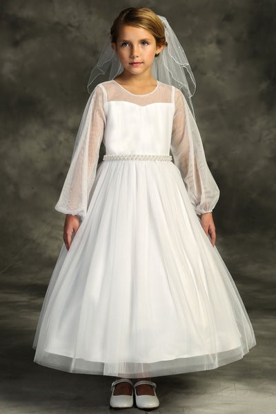 girl wearing white communion dress with veil