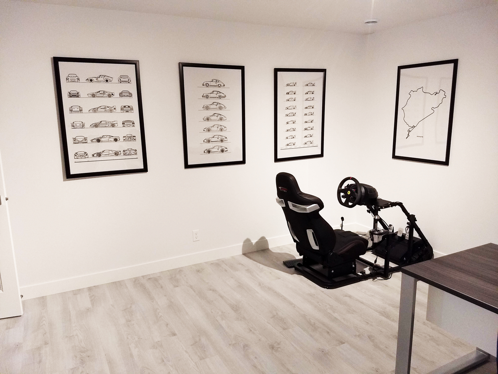 Home office with multiple car evolution posters