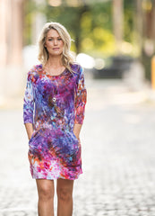 women's tie dyed dress in shades of purple, pink, and orange
