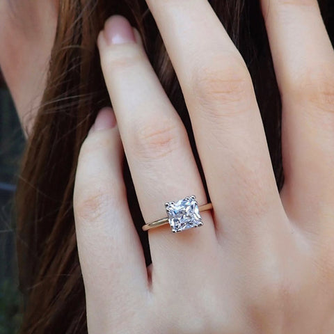Doyle & Doyle vintage cushion cut diamond solitaire engagement ring.