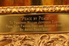 The plaque beneath "Peace by Peace"