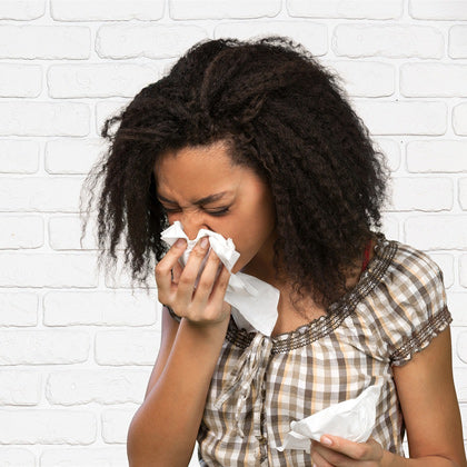 Cold and Flu Season - a Woman Sneezing