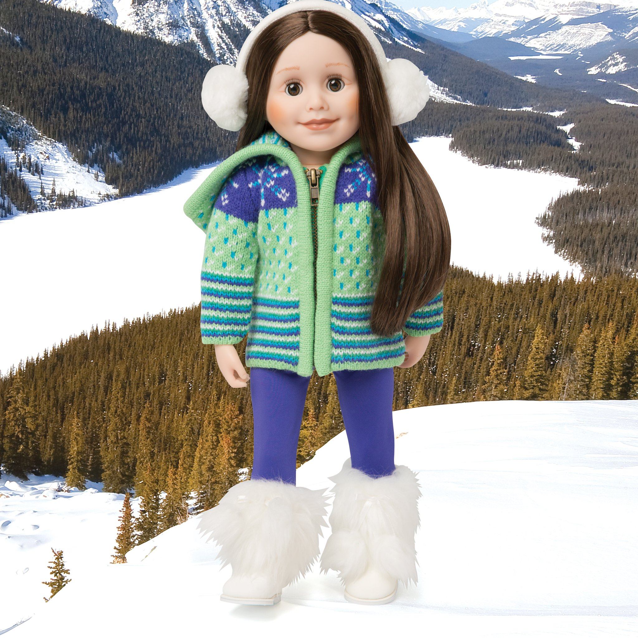 Apres ski green and purple sweater, purple tights, and white fluffy earmuffs. Fits all 18 inch dolls. Shown with white fluffy Maple Lodge boots on a snowy Banff background.