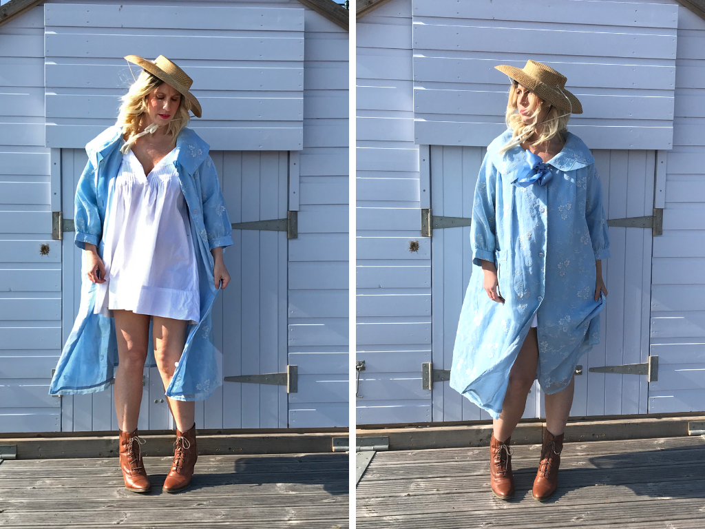 Two shots of blogger and influencer Jenny Mandera, standing in front of a pale blue beach hut on Budleigh beach. In the left hand image, she wears a sky blue flocked organza swing coat, an original fifties coat from our collection. She has teamed it with a straw hat and tan ankle boots. In the second image, she has unbuttoned her coat to show the Edwardian nightshirt beneath, the wind whipping her blonde hair across her face. 