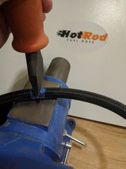 Cutting PTFE lined stainless braided hose with a chisel