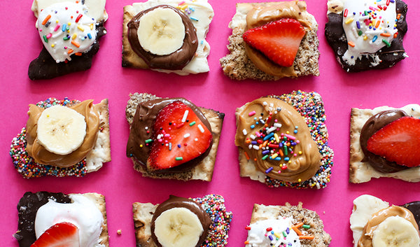 Chocolate covered matzo with assorted dessert spreads