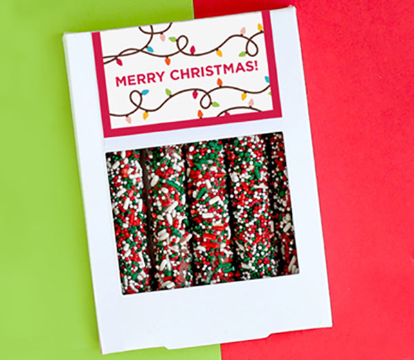 White box of five pretzels with red, green and white sprinkles and customized Christmas design