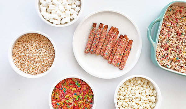 Marshmallows, white chocolate chips, fruity pebbles, rice krispies and fruity chocolate covered pretzels