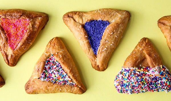 Hamentaschen made with pretzel dough, white chocolate and sprinkles