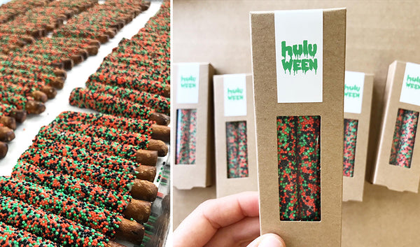 Kraft boxes of two pretzels with orange, green and black sprinkles pretzels and Hulu Halloween logo design