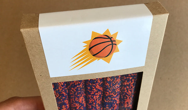 Kraft boxes of five pretzels with orange and purple sprinkle colors and customized design with Phoenix Suns logo